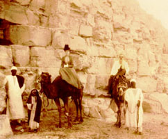 Perkins and his wife are pictured riding camels at the Egyptian pyramids at Cheops in 1900 Perkins and his wife are pictured riding camels at the Egyptian pyramids at Cheops in 1900