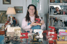 Dorsey with her toy sewing machines. Dorsey with her toy sewing machines.