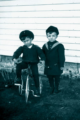 These little boys pose wearing sailor suits with short pants in Russell.
