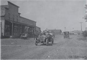 Cars passing through Dorrance, Kansas, as part of Glidden Tour